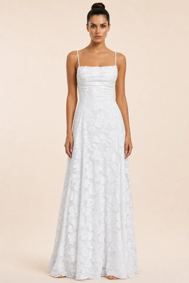 White jacquard ruched maxi dress on model in contrapposto stance