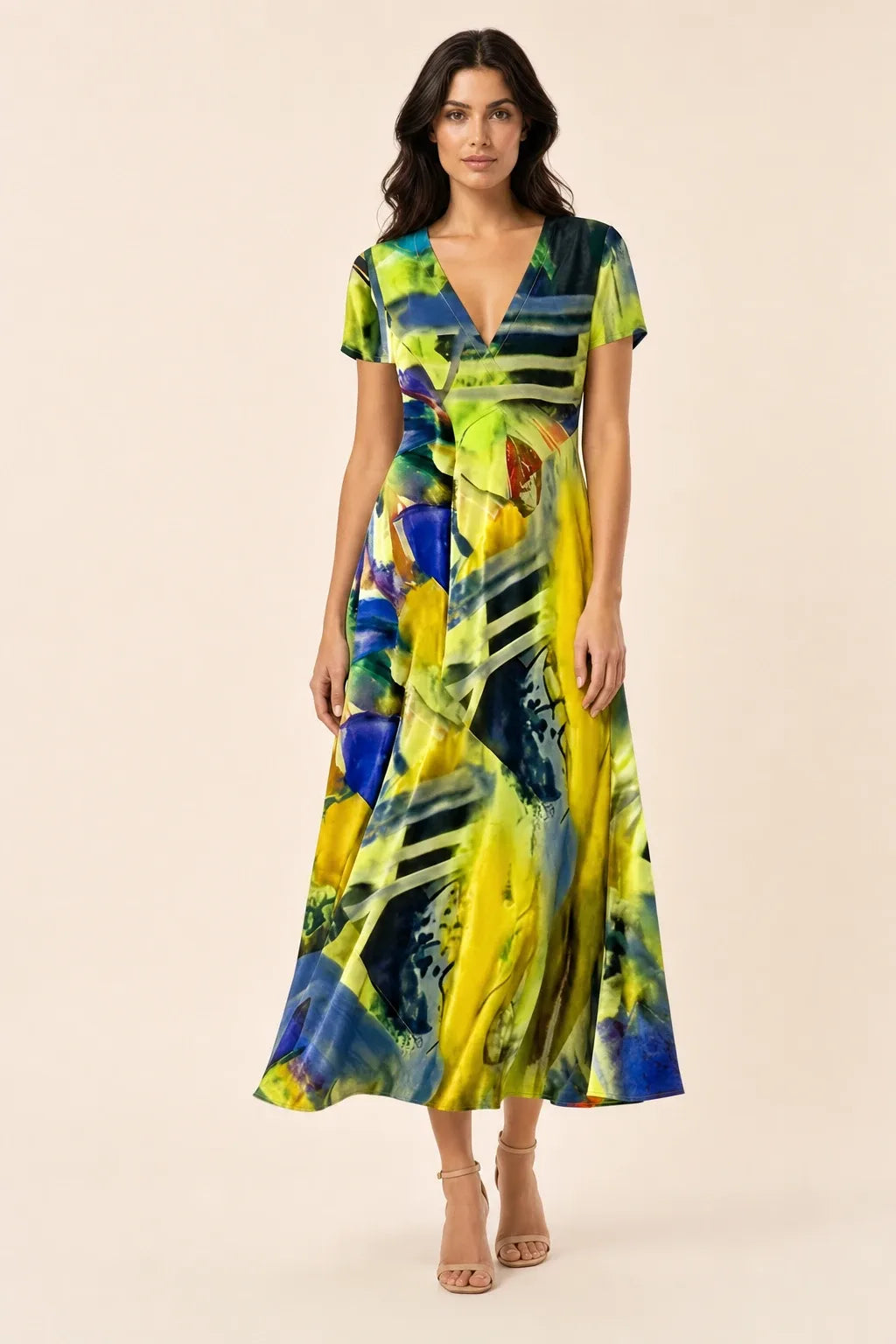 Green abstract print midi dress on model in contrapposto stance