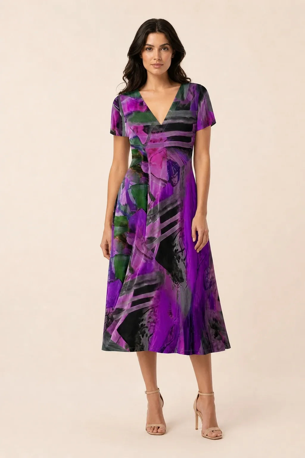 Purple abstract print midi dress on model in contrapposto stance