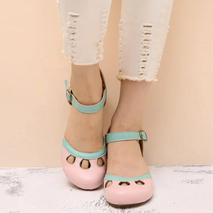 Pink cutout Mary Jane pump with block heel, front view