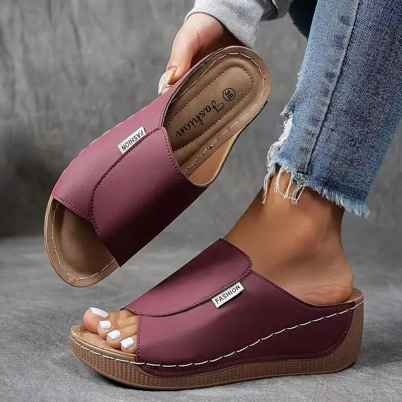 Burgundy wedge platform mule, heel view displaying wedge height and back strap