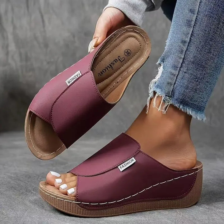 Burgundy wedge platform mule, heel view displaying wedge height and back strap