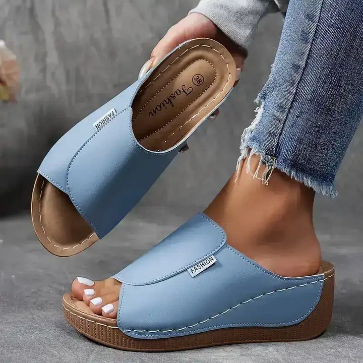 Light blue wedge platform mule shown from additional angle