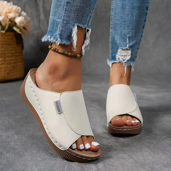 White wedge platform mule from alternate styling angle