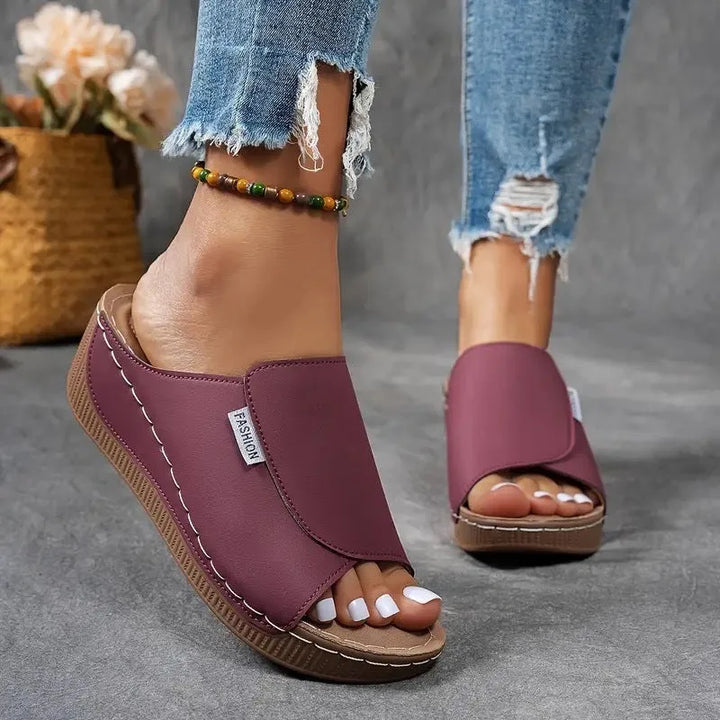 White wedge platform mule showcasing fit and form from secondary view