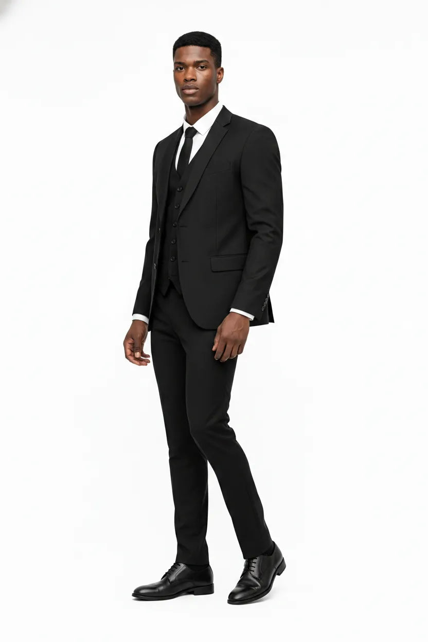 Black linen three-piece suit on a model in a three-quarter turn