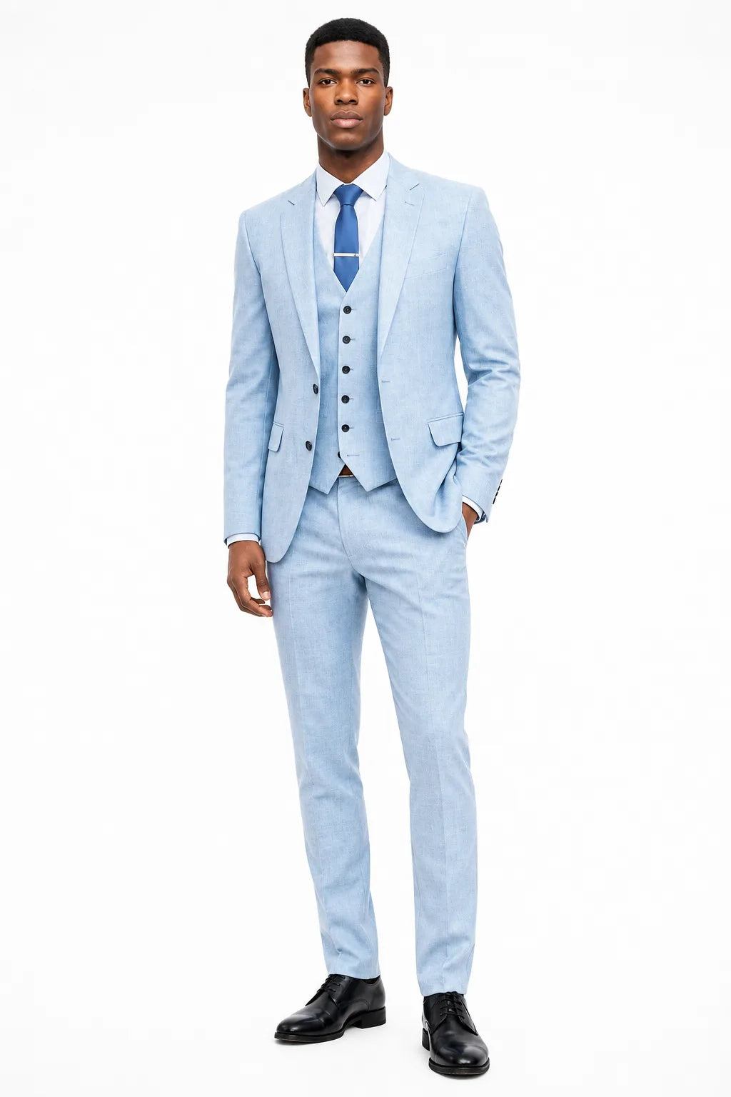Blue linen three-piece suit on a model in a contrapposto stance
