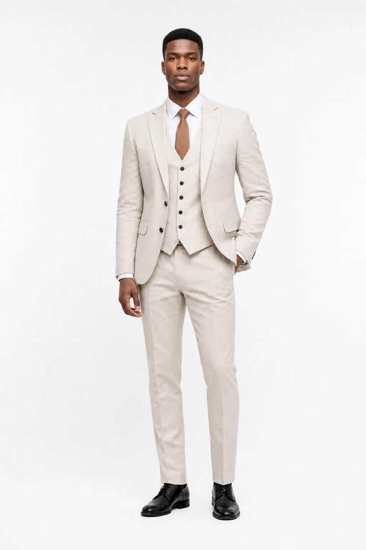 Ivory linen three-piece suit on a model in a contrapposto stance