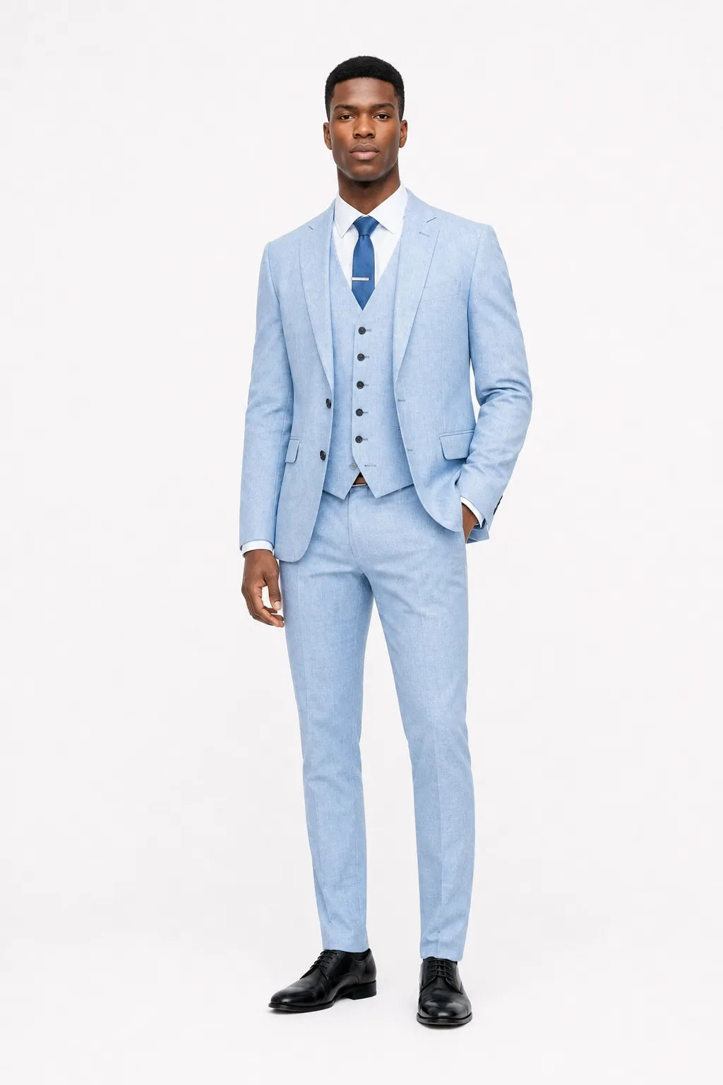 Sky blue linen three-piece suit on a model in a contrapposto stance