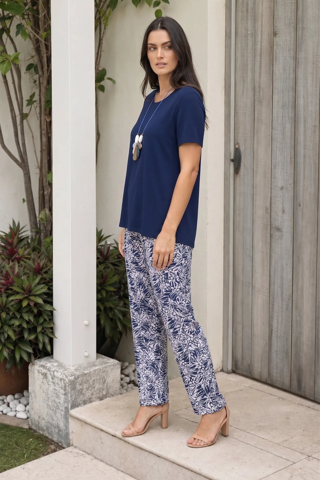 Navy blue swing top set, model shown at a three-quarter turn