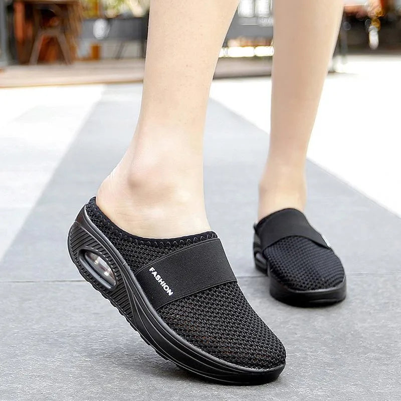 Close-up detail of red cushioned slip-on mule sneaker
