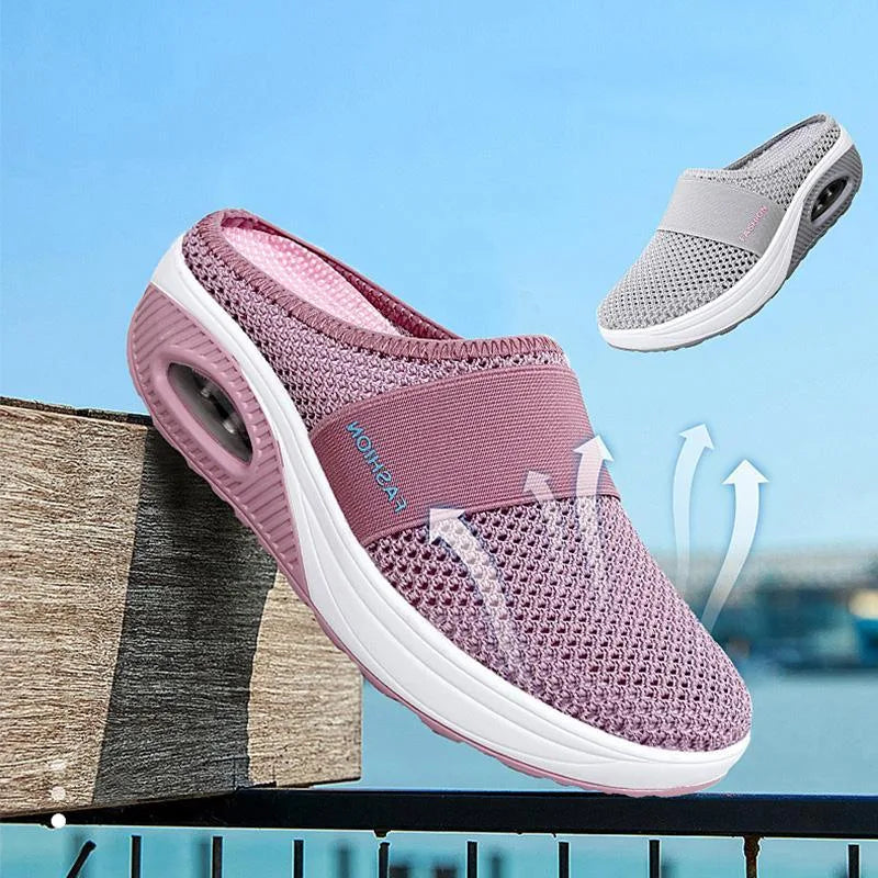 Red cushioned slip-on mule sneaker, three-quarter angle view