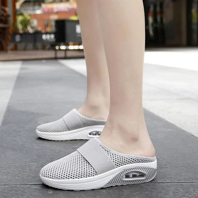 Red cushioned slip-on mule sneaker, sole view