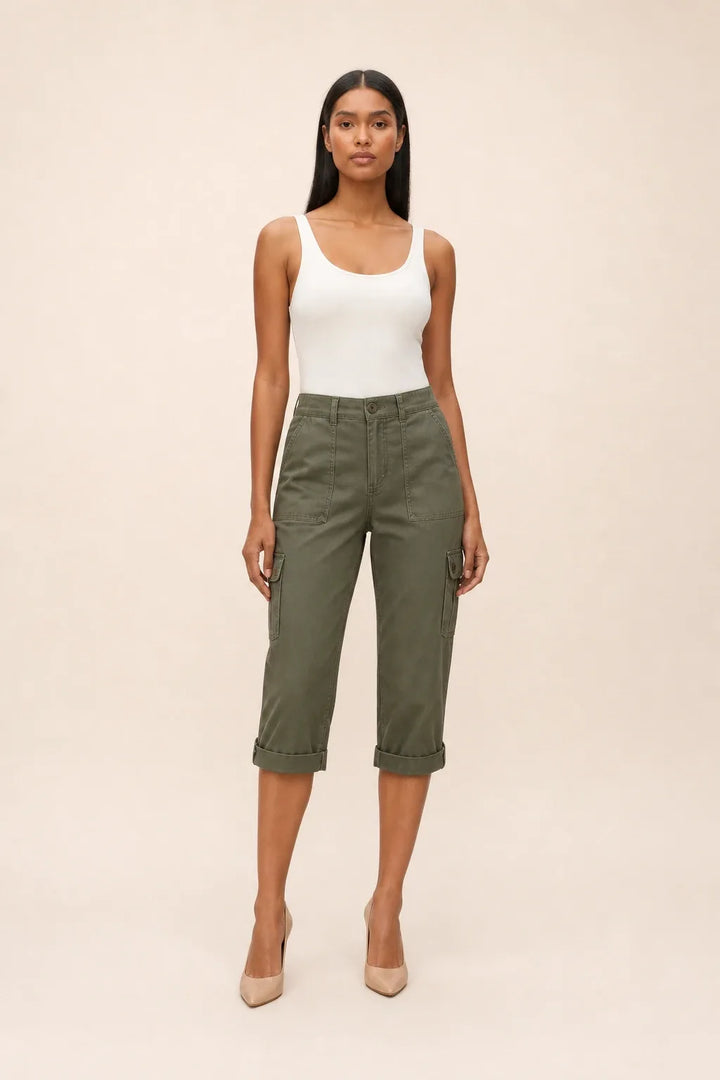 Army green cargo capri pants on a model in a contrapposto stance, with side cargo pockets