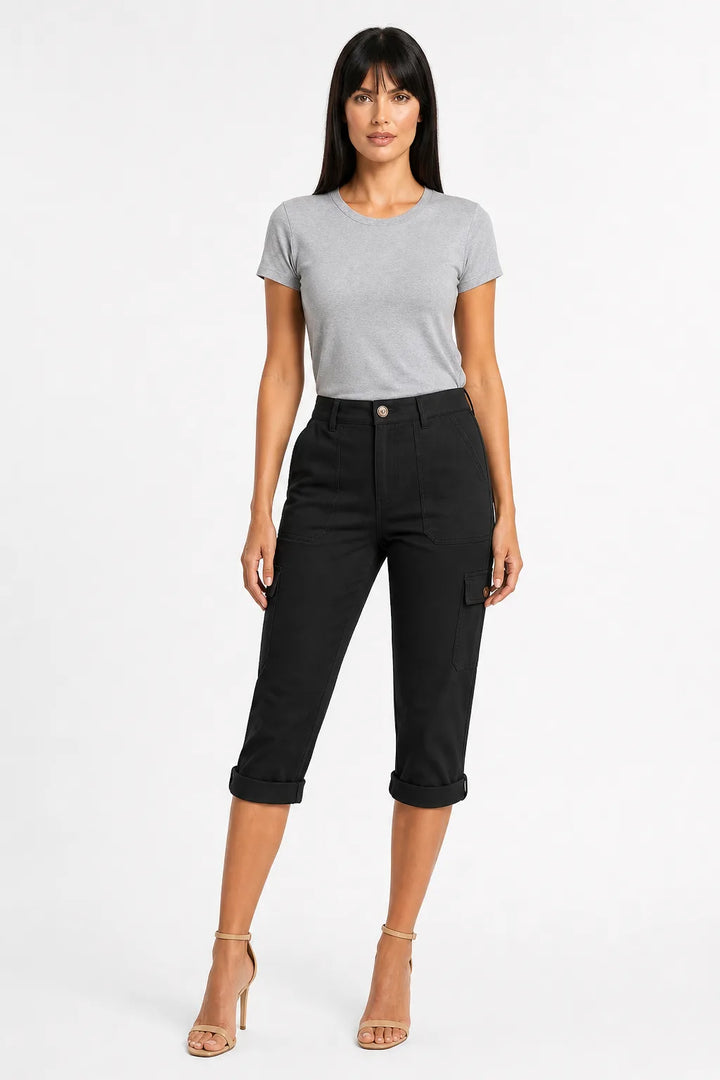 Black cargo capri pants with side pockets on a model in a contrapposto stance