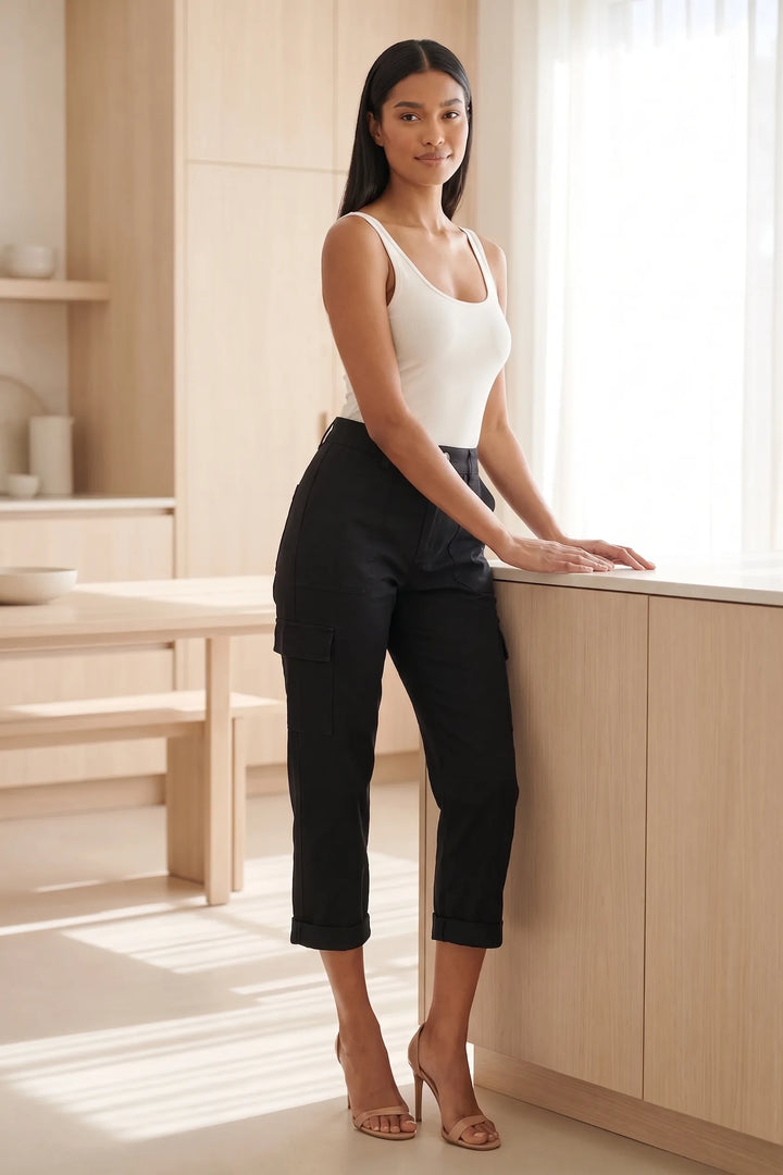Model wearing black cargo capri pants in a casual lifestyle setting
