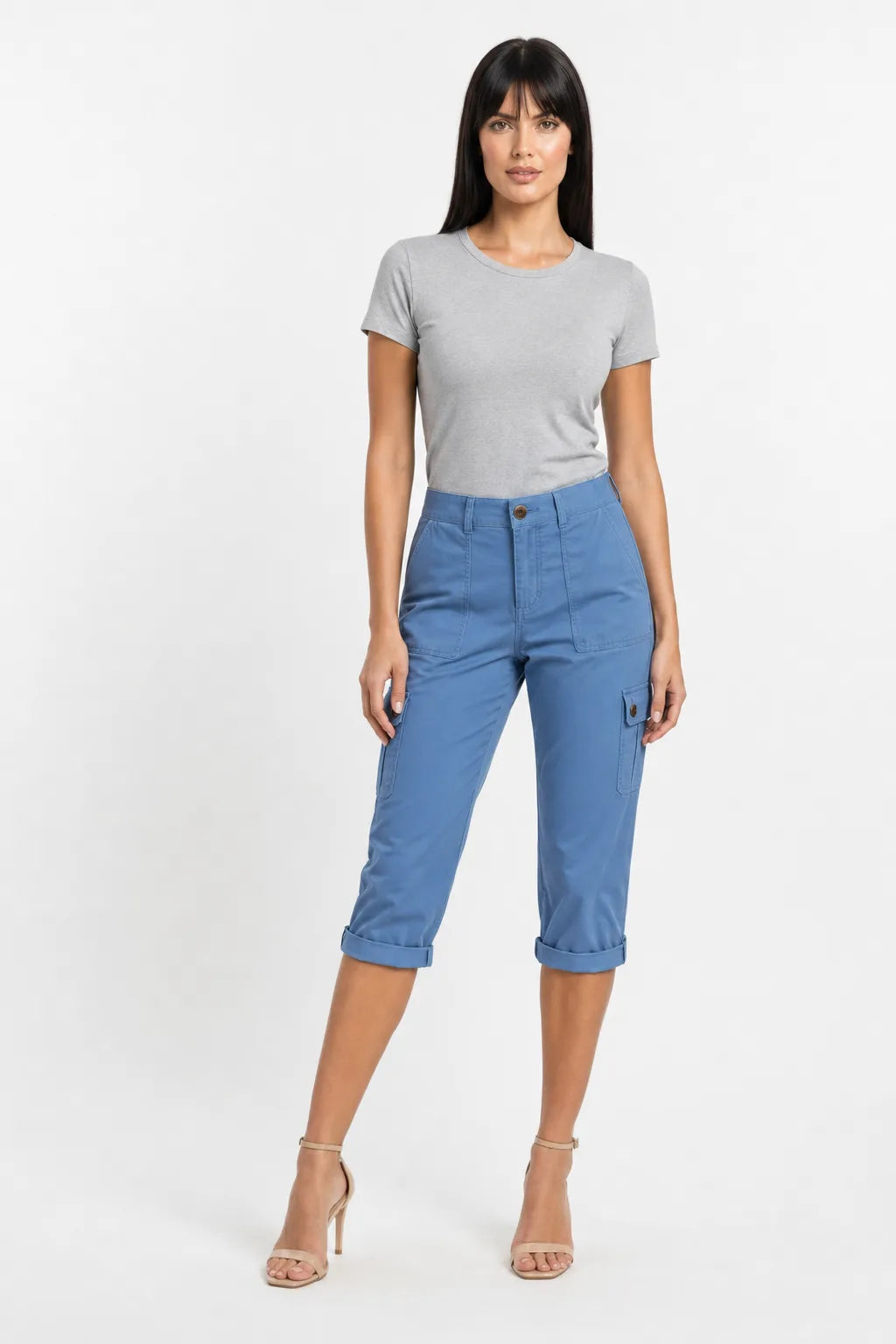 Blue cargo capri pants with side pockets on a model in a contrapposto stance