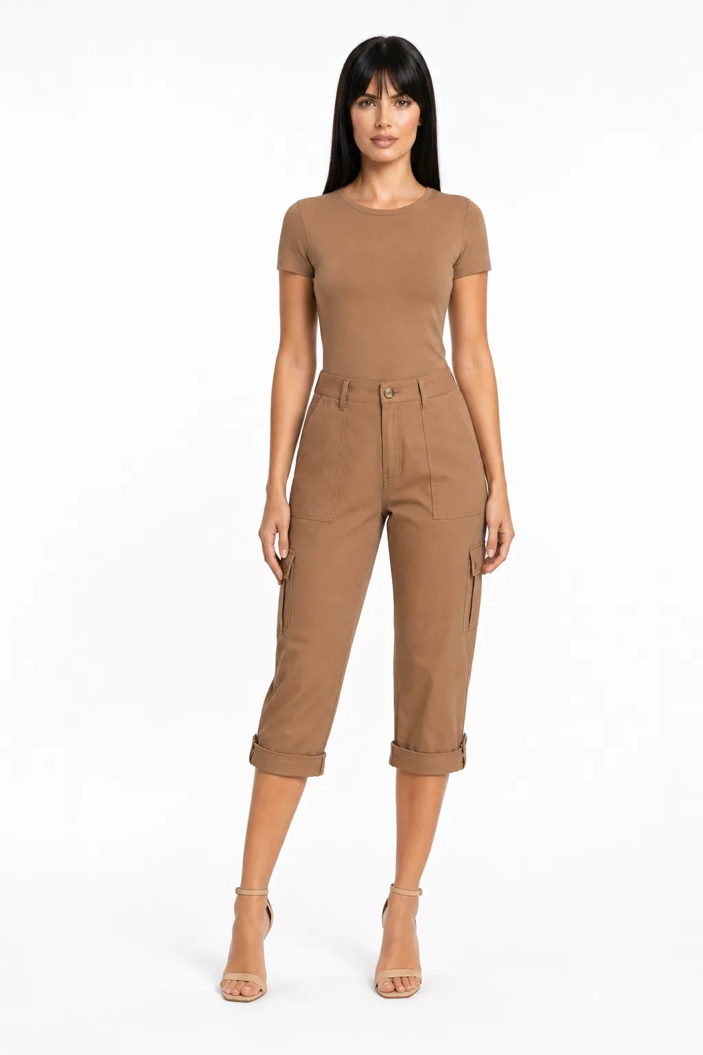 Coffee brown cargo capri pants with side pockets on a model in a contrapposto stance