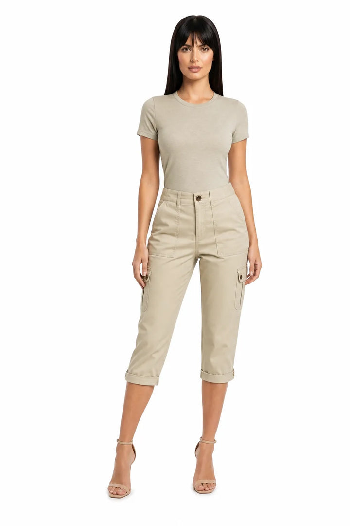 Khaki cargo capri pants with side pockets on a model in a contrapposto stance