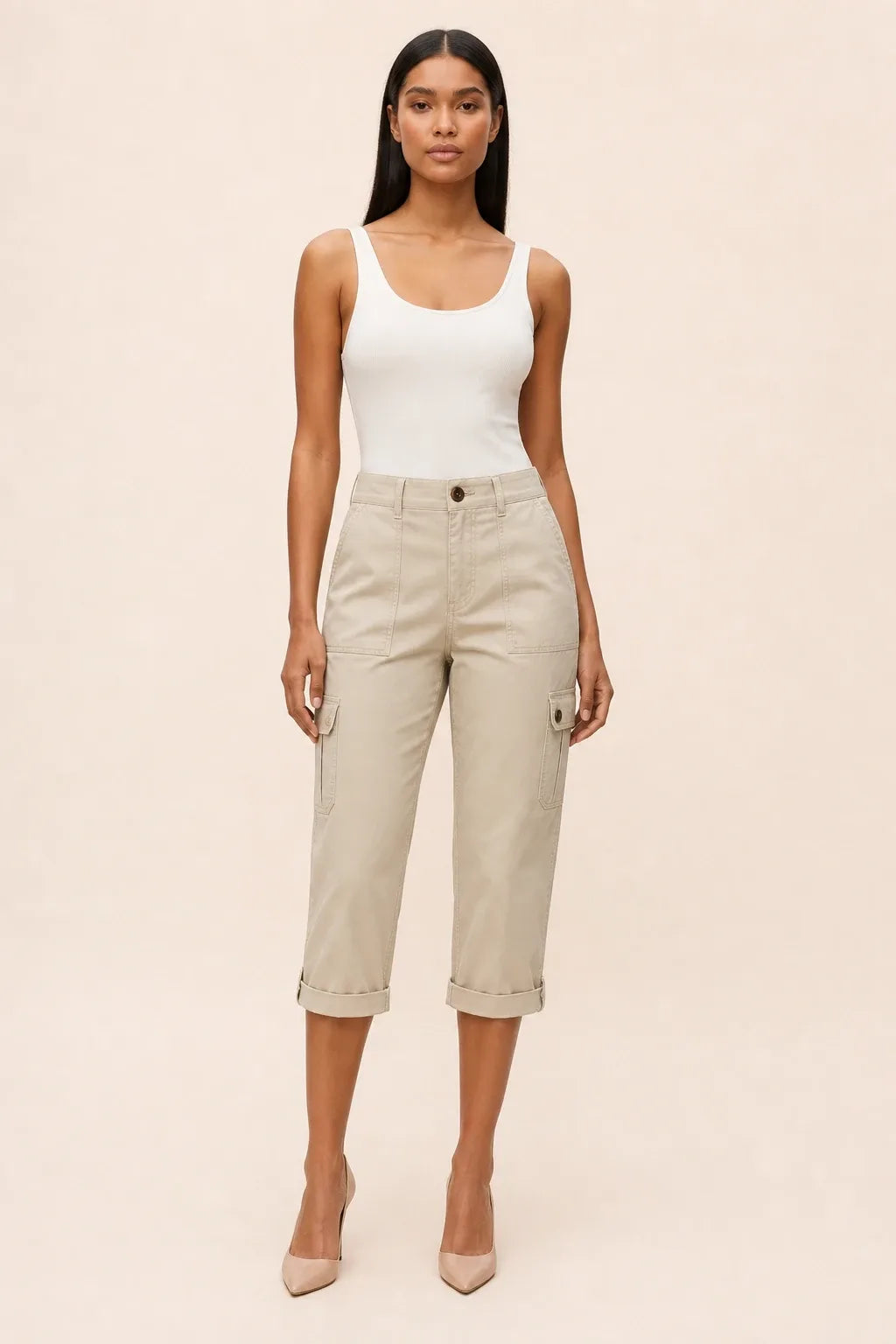 Khaki cargo capri pants on a model in a contrapposto stance, with side cargo pockets