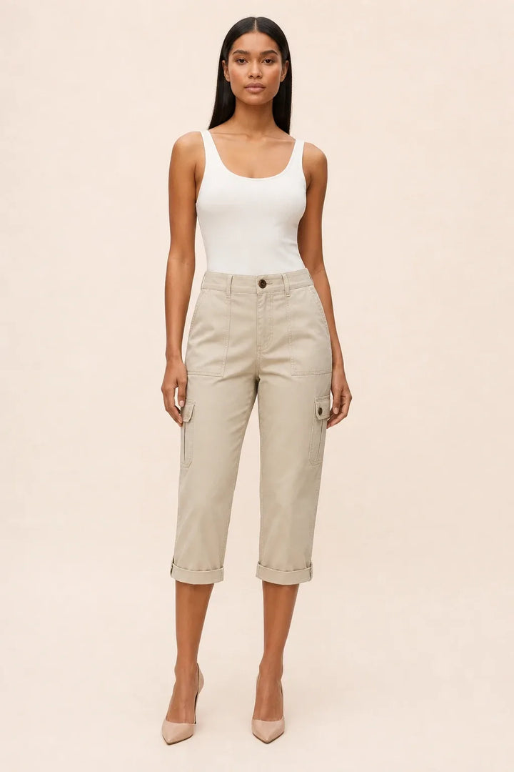 Khaki cargo capri pants on a model in a contrapposto stance, with side cargo pockets