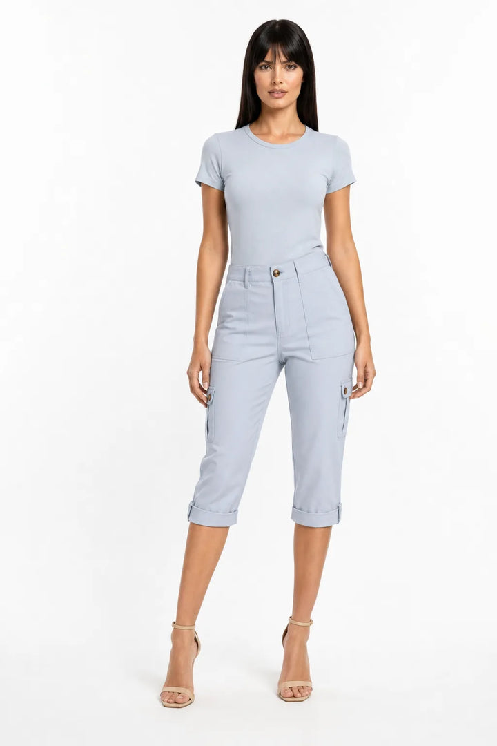 Light blue cargo capri pants with side pockets on a model in a contrapposto stance