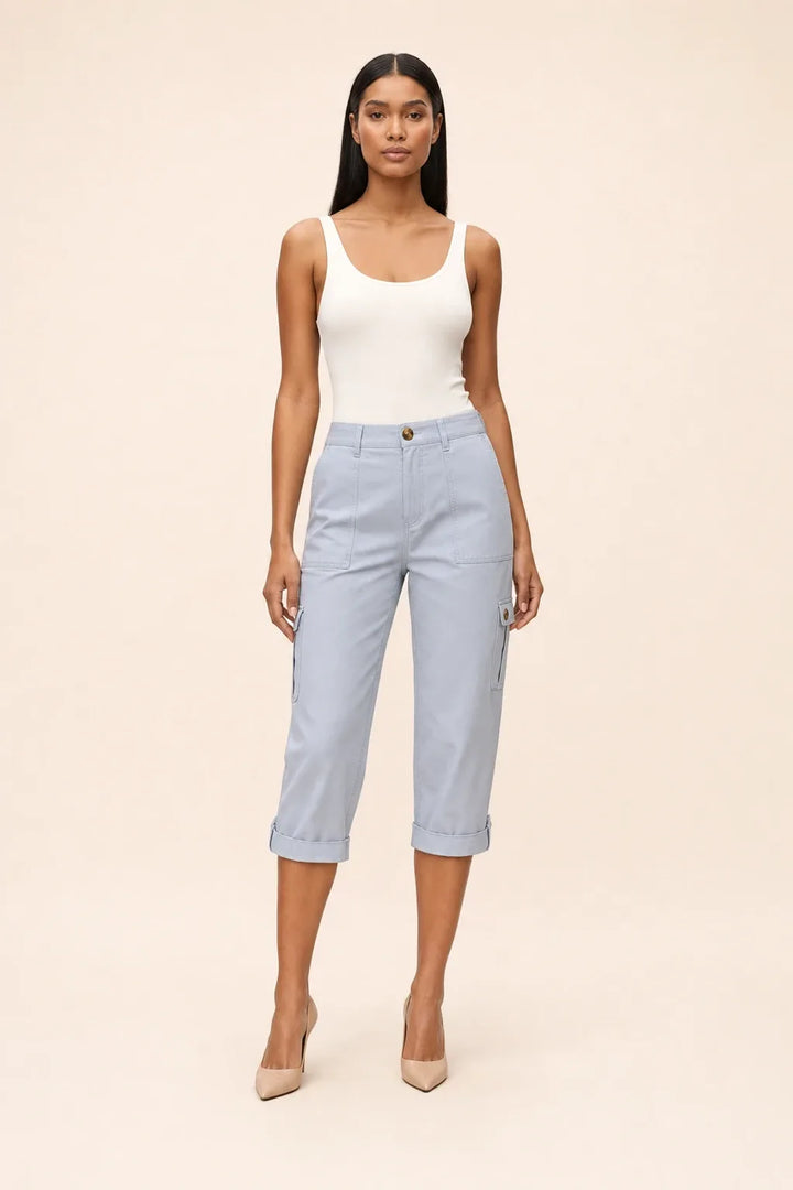 Light blue cargo capri pants on a model in a contrapposto stance, with side cargo pockets
