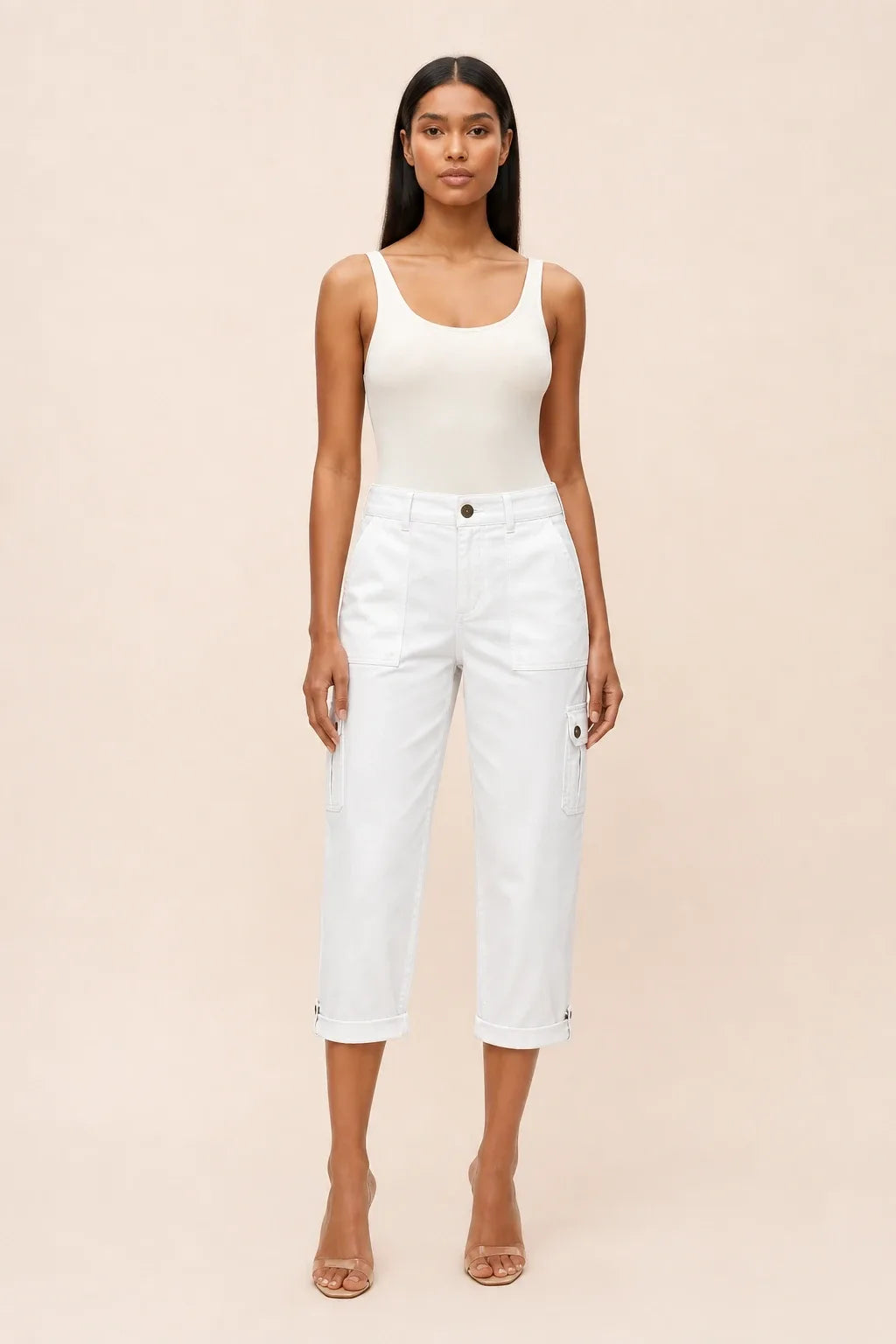 White cargo capri pants on a model in a contrapposto stance, with side cargo pockets