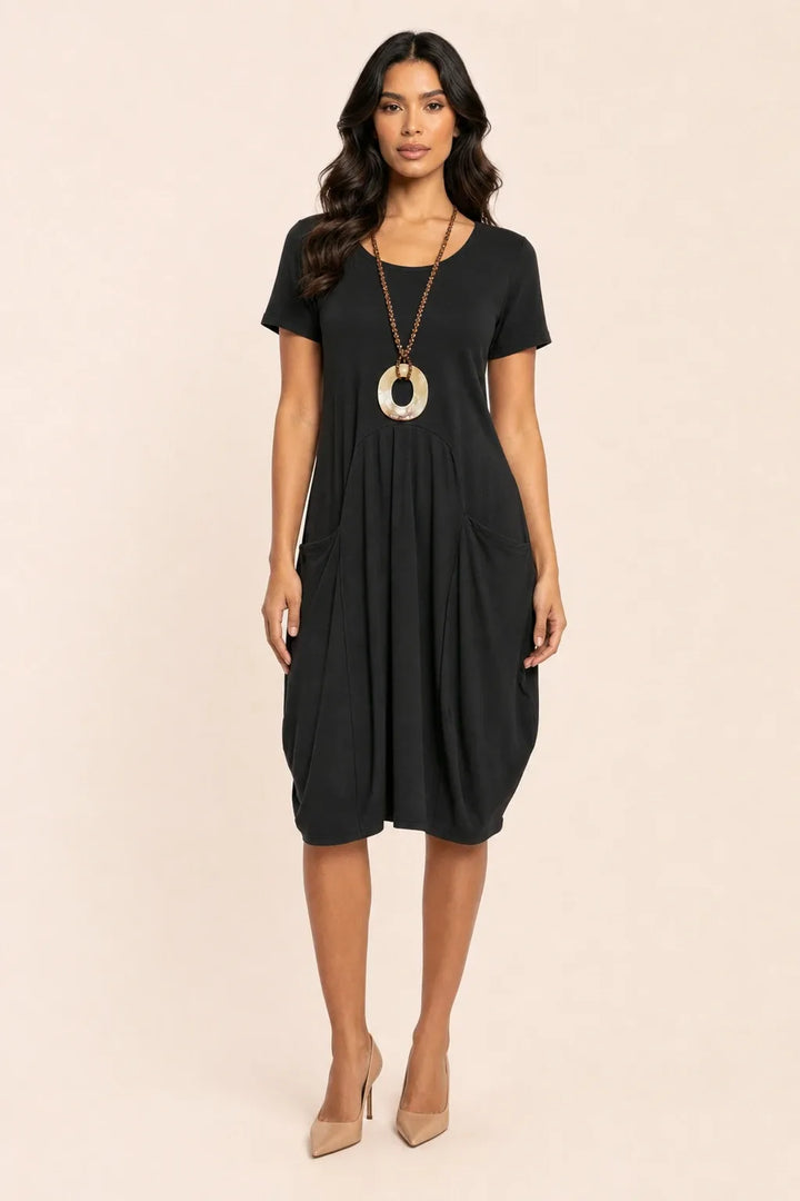Black and red flowy midi dress with pockets on model in contrapposto stance