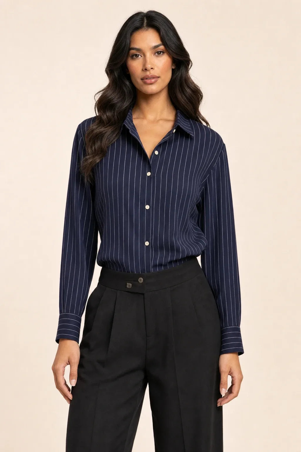 Blue pinstripe button-front blouse on model in contrapposto stance
