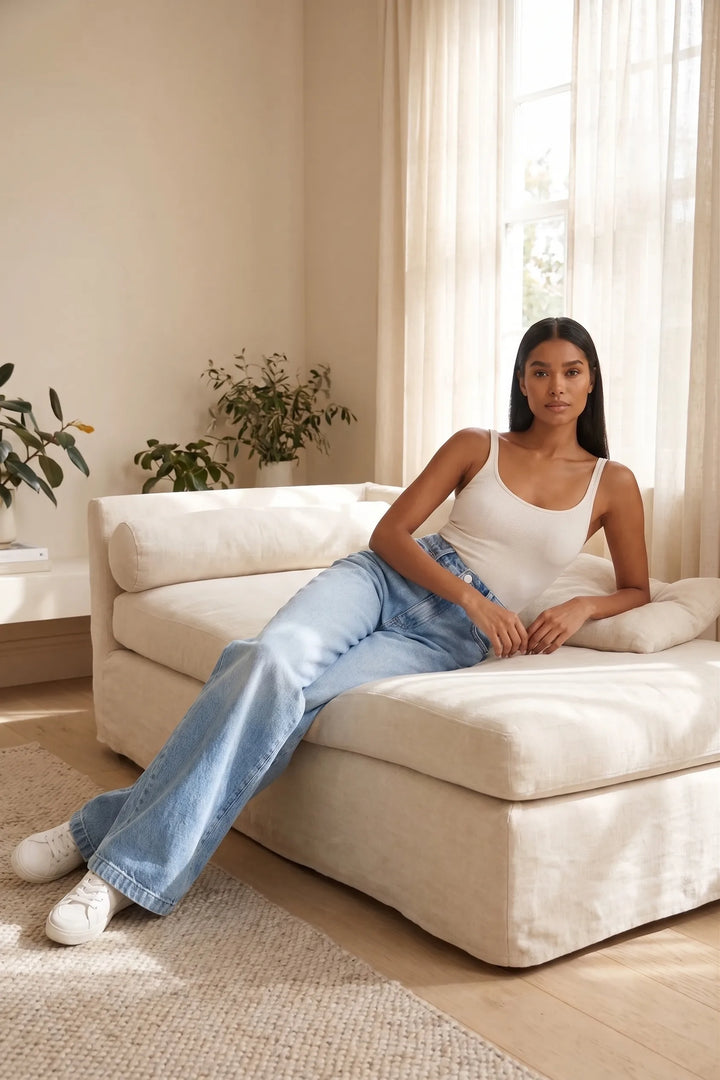 Woman in wide-leg blue jeans outdoors in a relaxed lifestyle moment