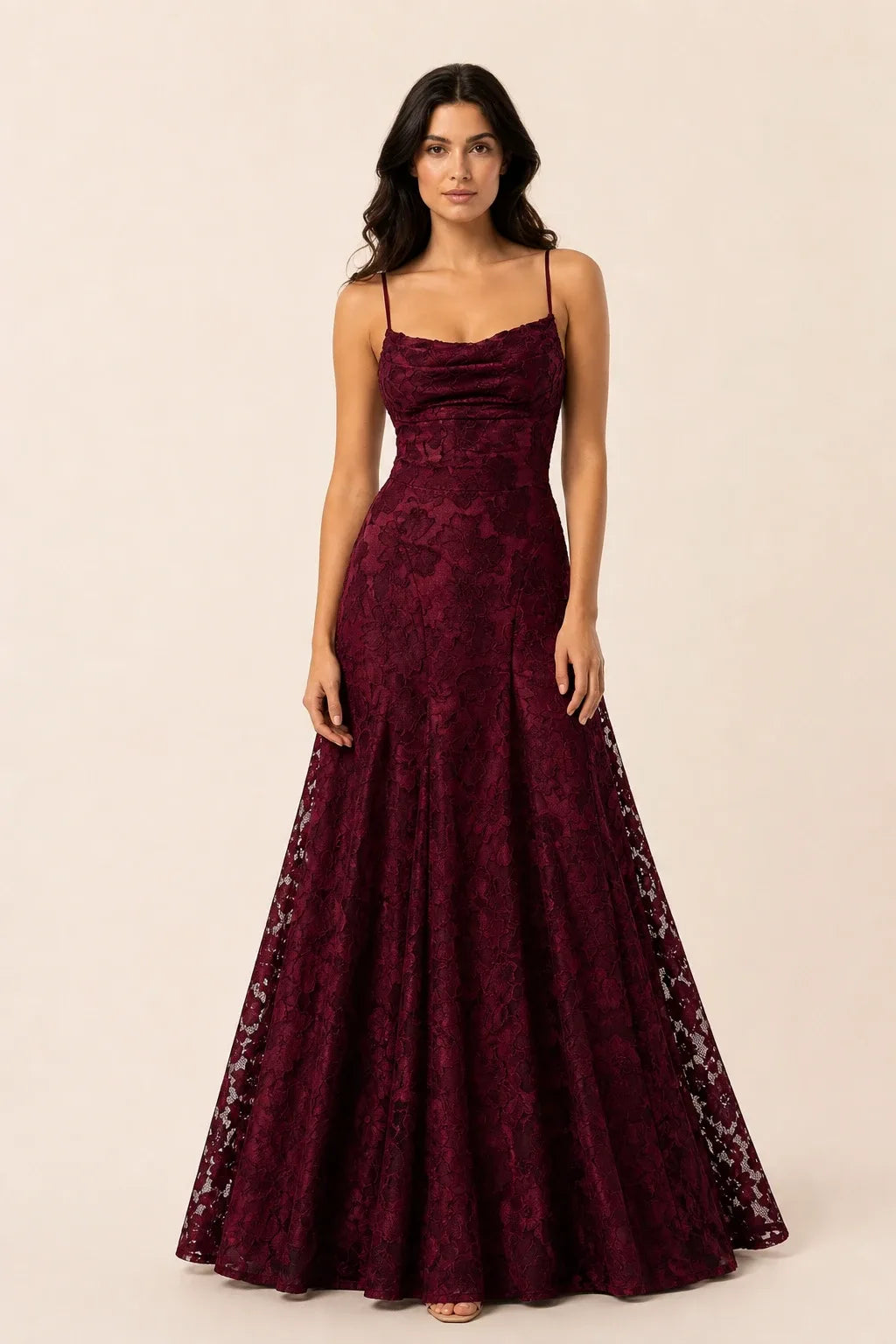 Burgundy lace open-back gown on a model in a contrapposto stance