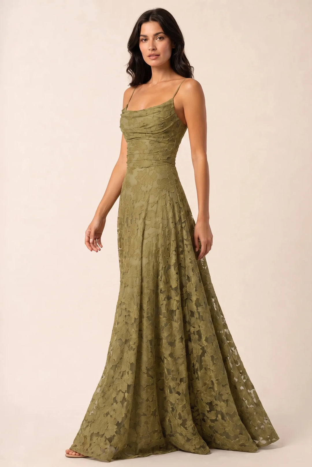 Olive green lace open-back gown on a model in a three-quarter turn