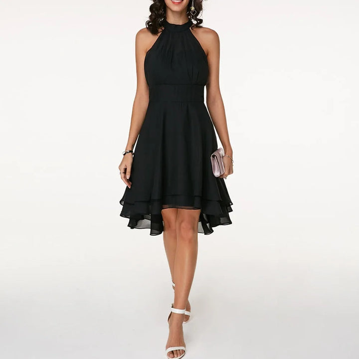 Black tiered ruffle halter top on model, side view