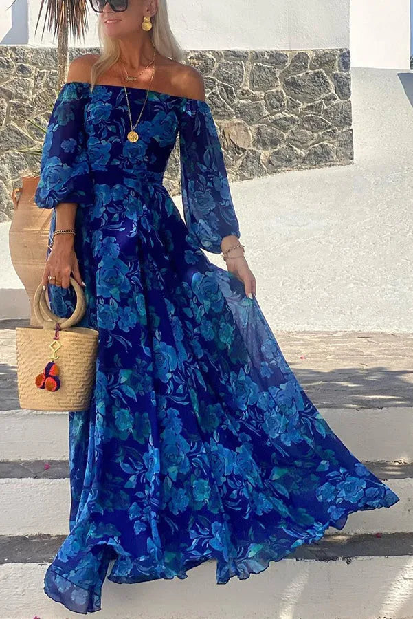 Woman wearing a blue floral off-shoulder maxi dress, facing forward