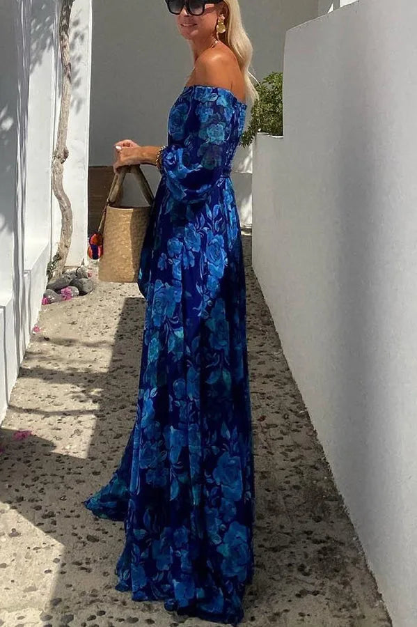 Woman wearing a blue floral off-shoulder maxi dress, side view