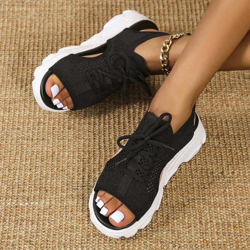 Black lace-up platform sandal, heel view