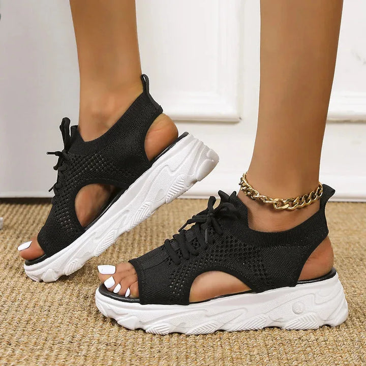 Black lace-up platform sandal, three-quarter angle view