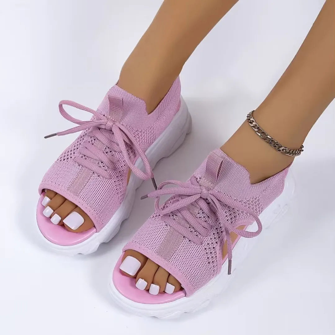 Pink lace-up platform sandal, styled on-foot view