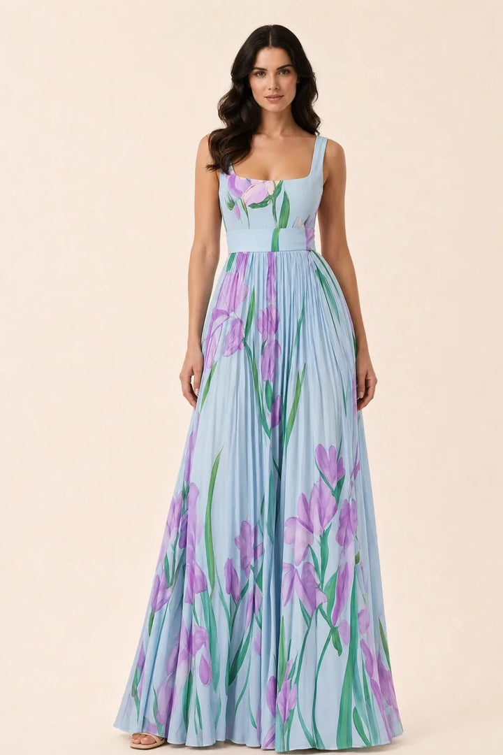 Blue pleated floral gown on model in contrapposto stance