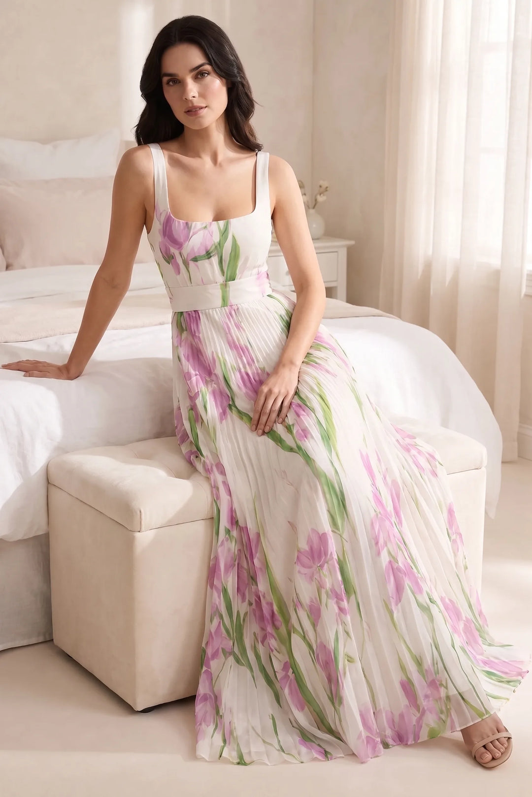 Model wearing white pleated floral gown in outdoor lifestyle setting