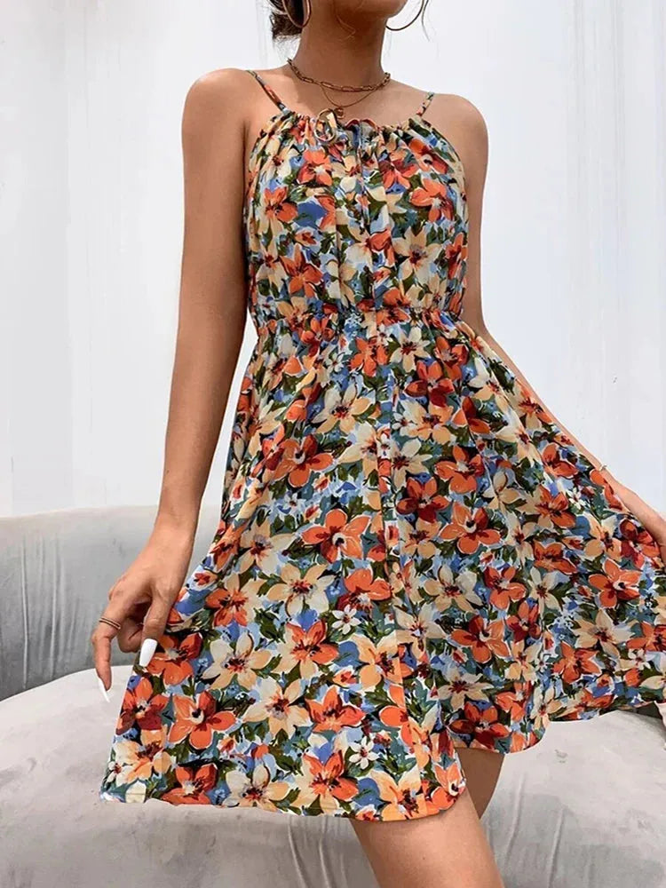 Woman wearing an orange floral halter sundress
