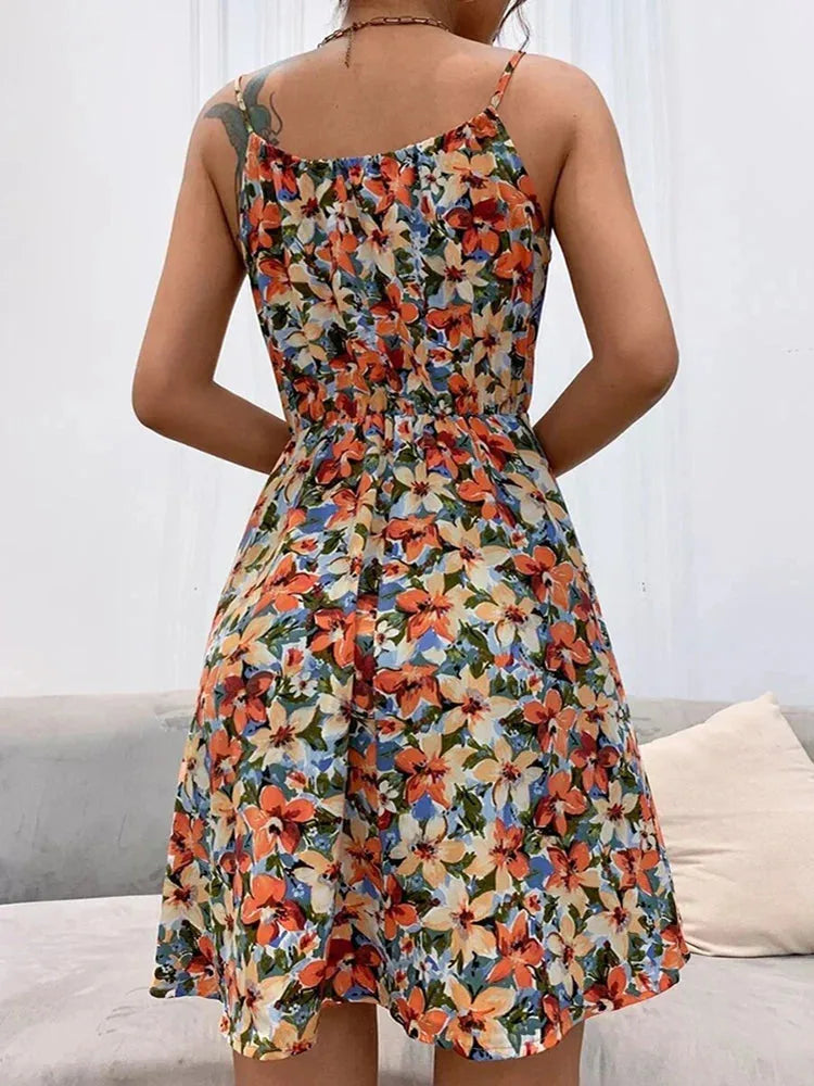 Close-up detail of a pink floral halter sundress fabric and neckline