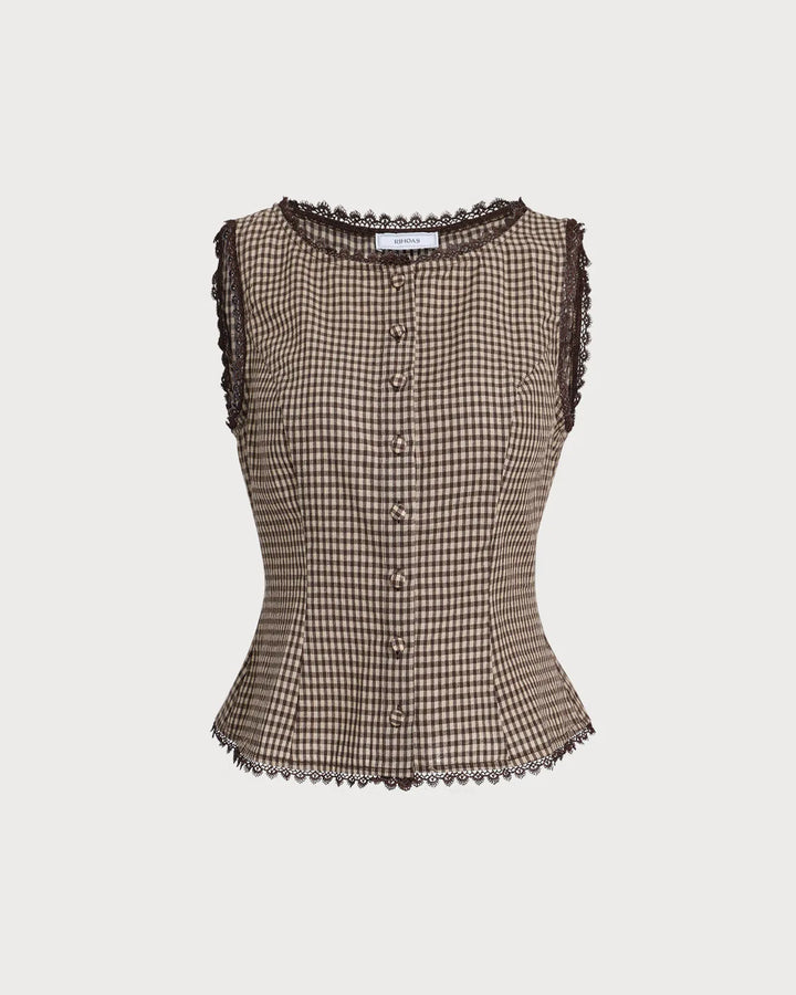 Woman modeling a brown gingham top with delicate lace trim accents