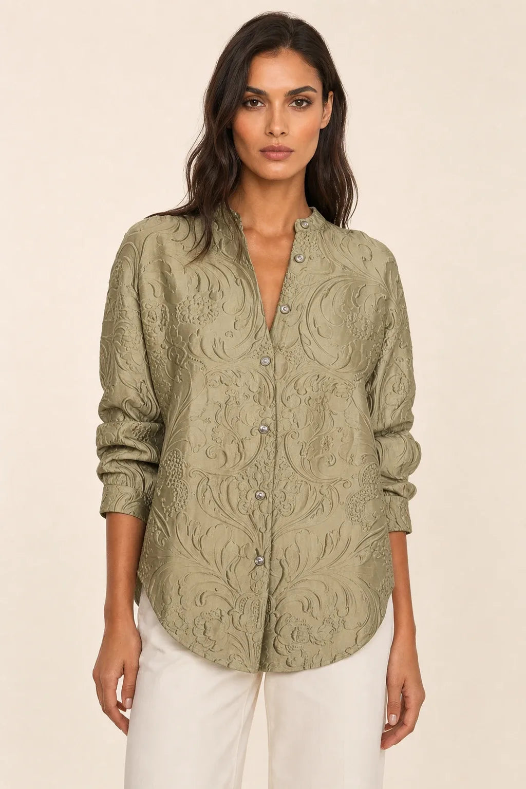 Green embossed floral blouse on model in contrapposto stance, front view