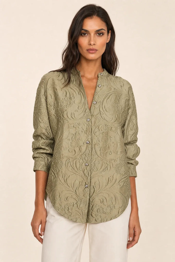 Green embossed floral blouse on model in contrapposto stance, front view