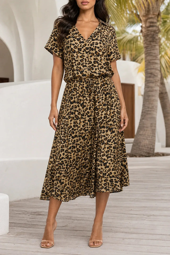 Khaki spotted print midi dress on model in contrapposto stance