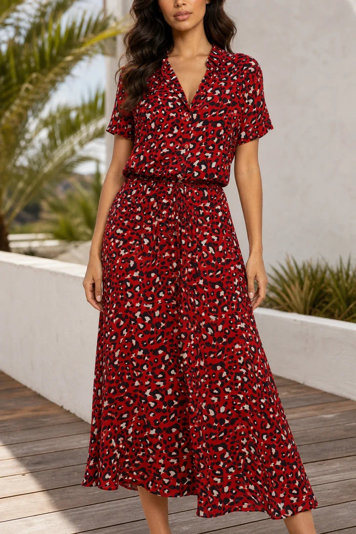 Red spotted print midi dress on model in contrapposto stance