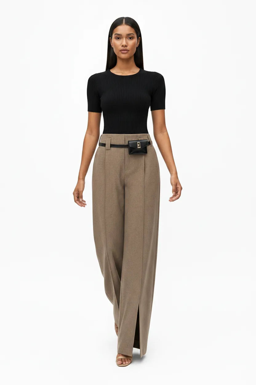 Khaki wide-leg belted trousers on model captured in natural movement