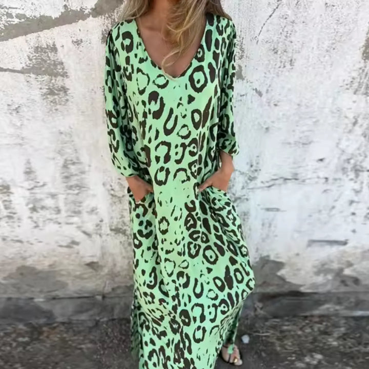 Green leopard print maxi dress displayed from the side on a standing model